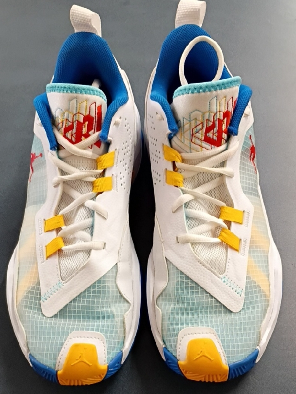 Nike Mens White Sneakers with Blue and Yellow Accents